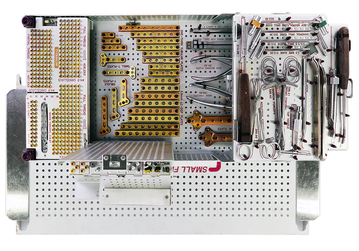 Synthes Small Frag plate set showing screws, plates, and tools commonly used in orthopedic fracture fixation. Source: AA Medical Supply Co.